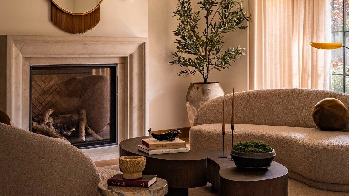 Minimalist picture frame cast stone mantel in a contemporary living room with soft neutral decor. Minimalist picture frame cast stone mantel in a contemporary living room with soft neutral decor.